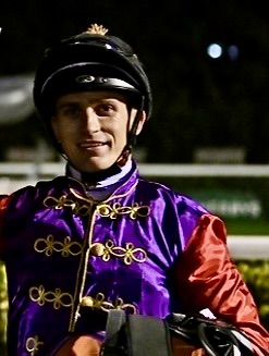 Proud moment: Collen Storey after winning in the king's silks. Photo supplied
