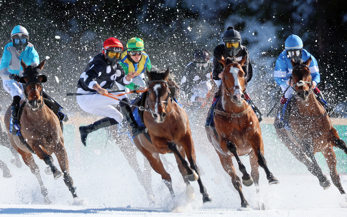 Off piste: Arc-winning jockey Rene Piechulek (red cap) is unseated at the White Turf. Photo: swiss-image/AndyMettler