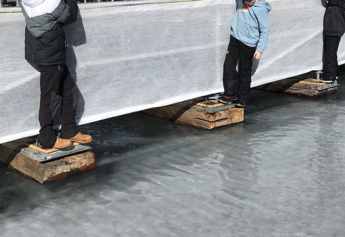 The tide is high: children avoid the snowmelt as temperatures rise in St Moritz. Photo: Steve Dennis