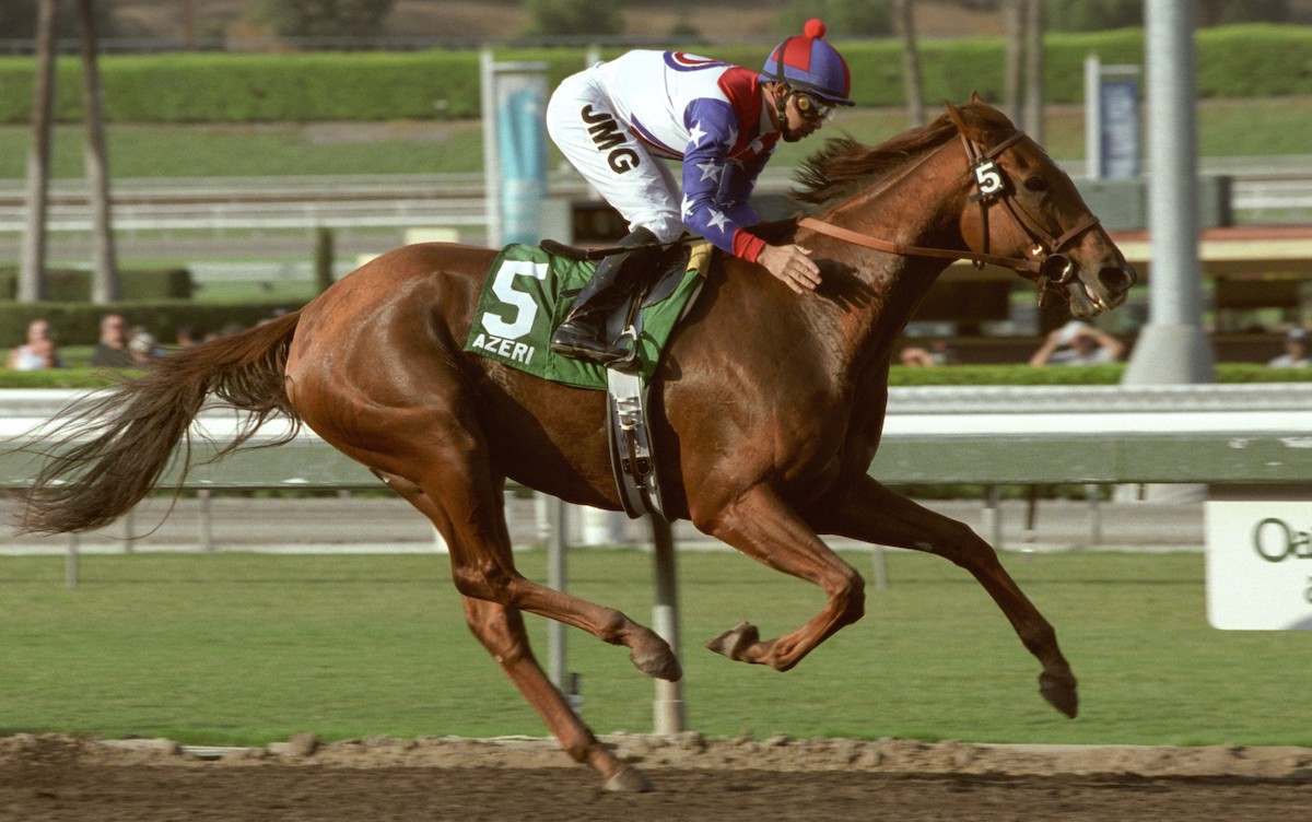 Mike Smith gives Azeri an appreciative pat after she carried 127 pounds to victory in the 2002 Lady's Secret Handicap at Santa Anita. Photo: Benoit