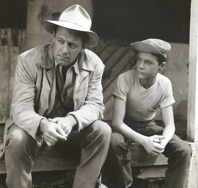 Johnny Stewart and William Holden as the kid and his agent. Photo: Columbia Studios