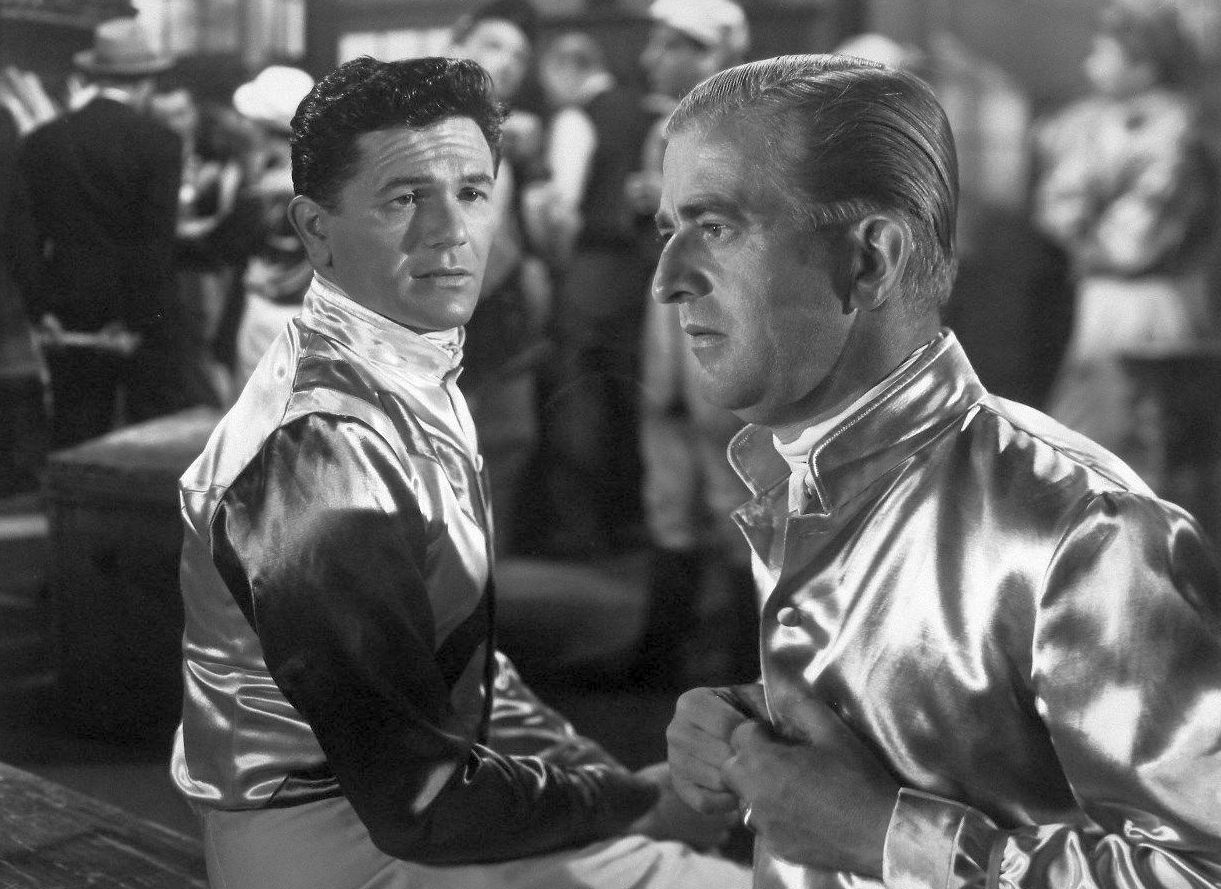 John Garfield and Noel Drayton as friendly rivals in the jockeys' room. (20th Century Fox photo)