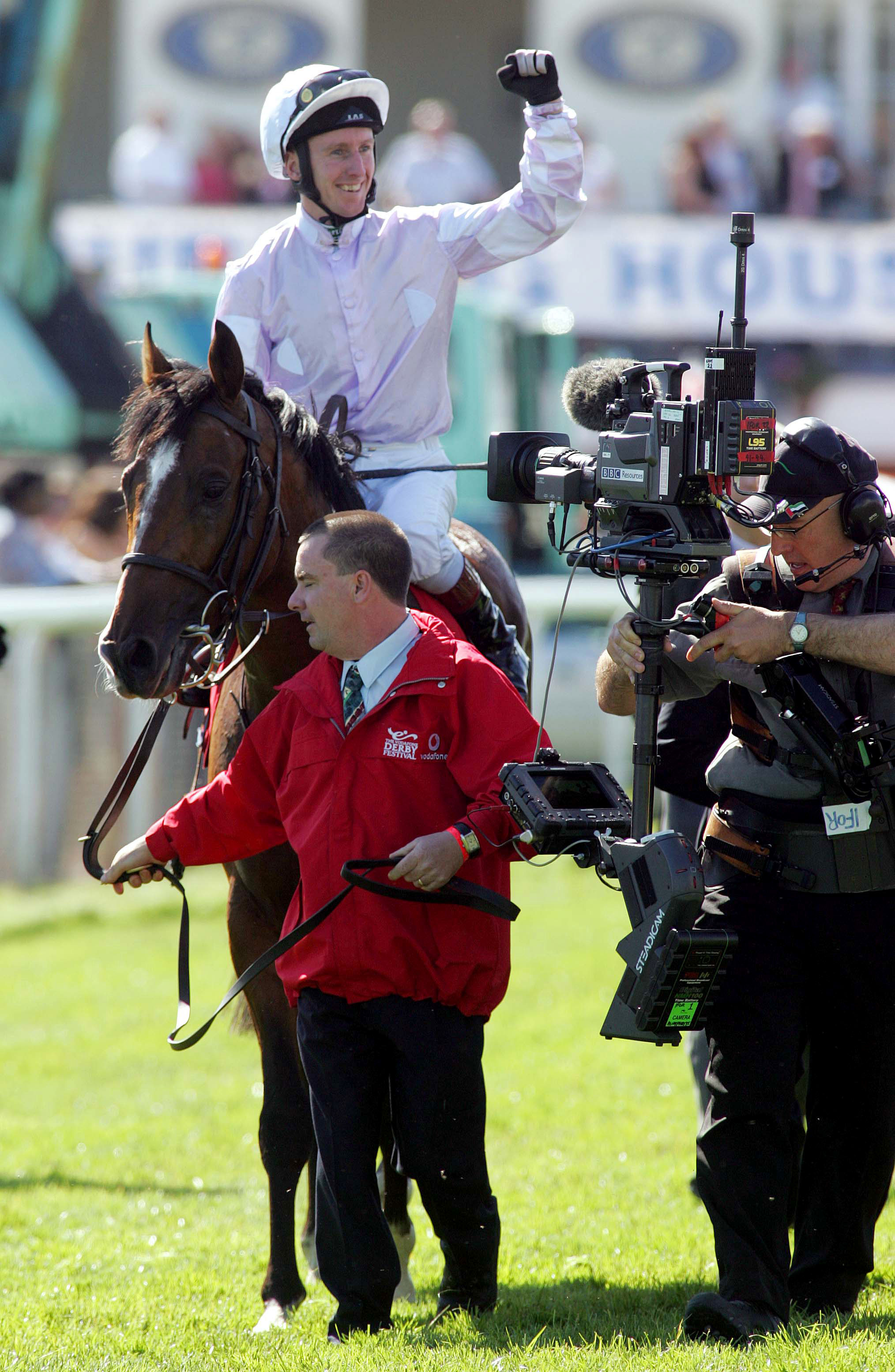 Finest hour: Martin Dwyer punches the air after winning the Derby on Sir Percy. Photo: Dan Abraham / focusonracing.com