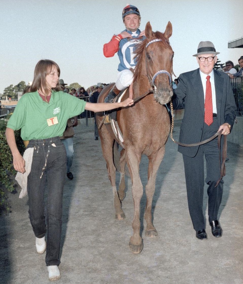 Fred Hooper and groom Allison Sgroi lead Precisionist and Chris McCarron down winner's circle lane after the 1986 Woodward Stakes. (Coglianese Photos)