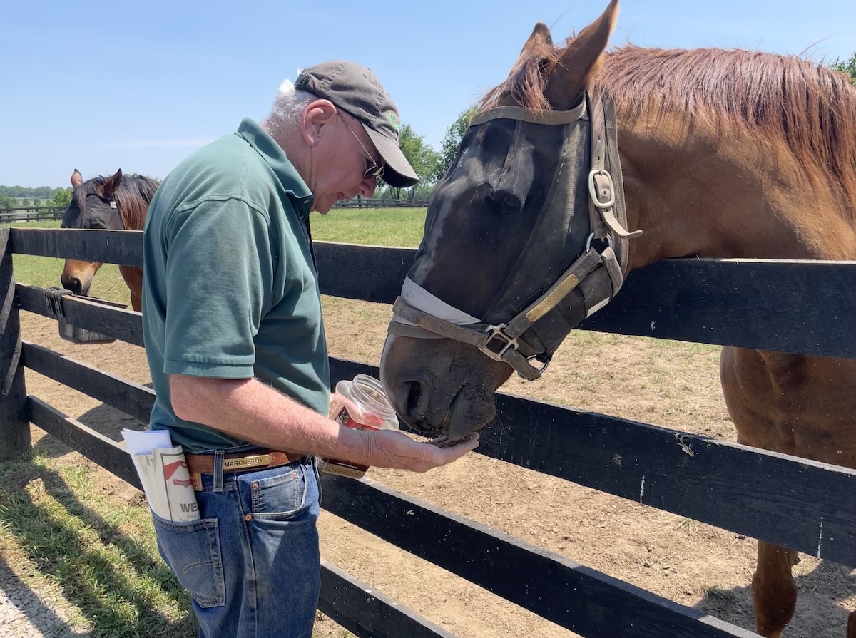 Snack time: Rapid Redux gets a treat from Michael Blowen. Photo: Amanda Duckworth