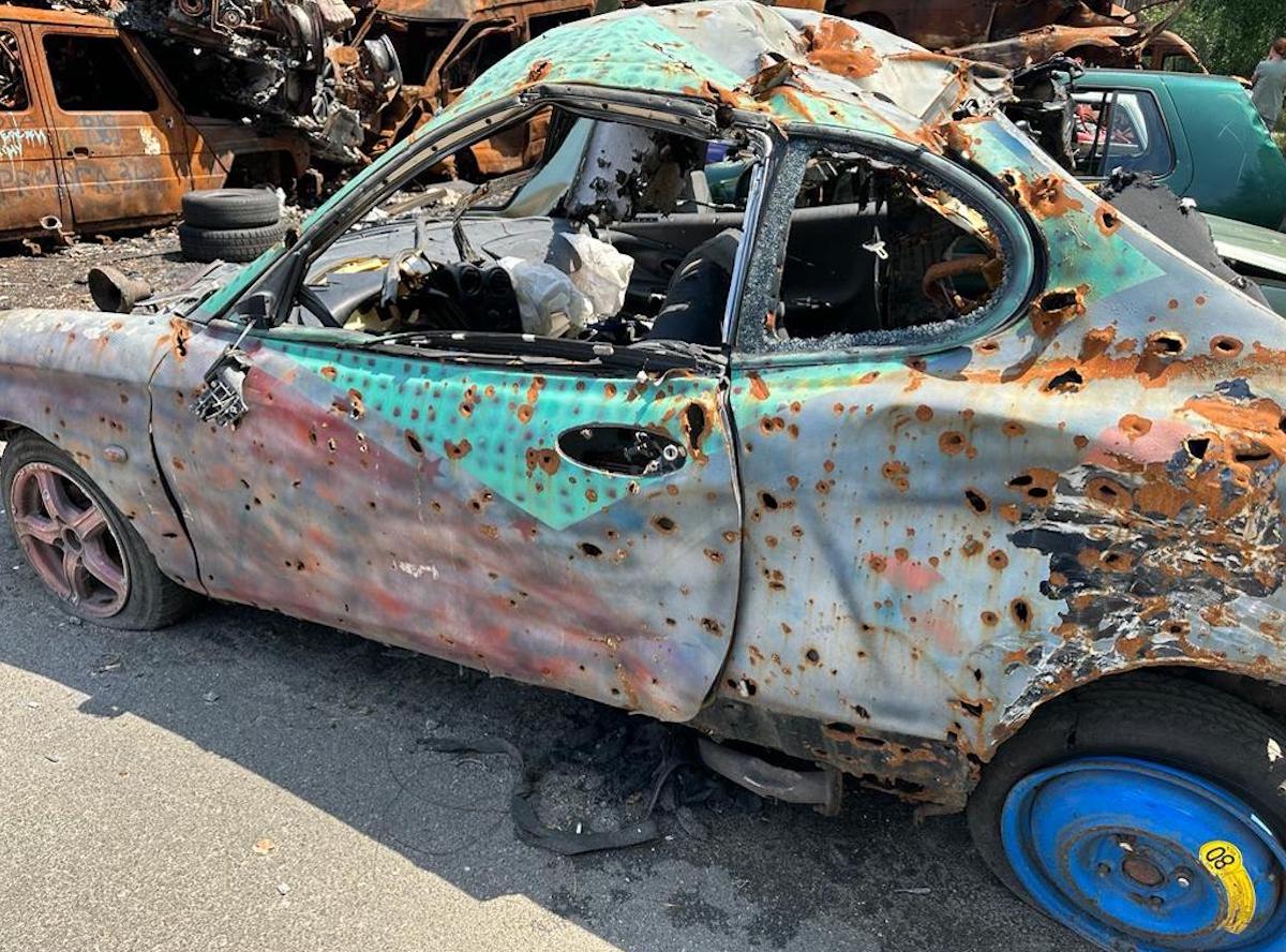 The shell of a car after Russian bombings. Photo: Craig Williams