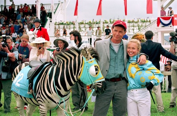 What a surprise! The zebra and family end up in the winner's circle (Warner Bros. photo)