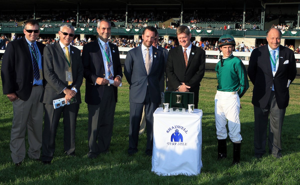 Gio Ponti's Shadwell Mile celebration included owner Shane Ryan (with beard), Ramon Dominguez, and Christophe Clement (far right). (Keeneland photo) 