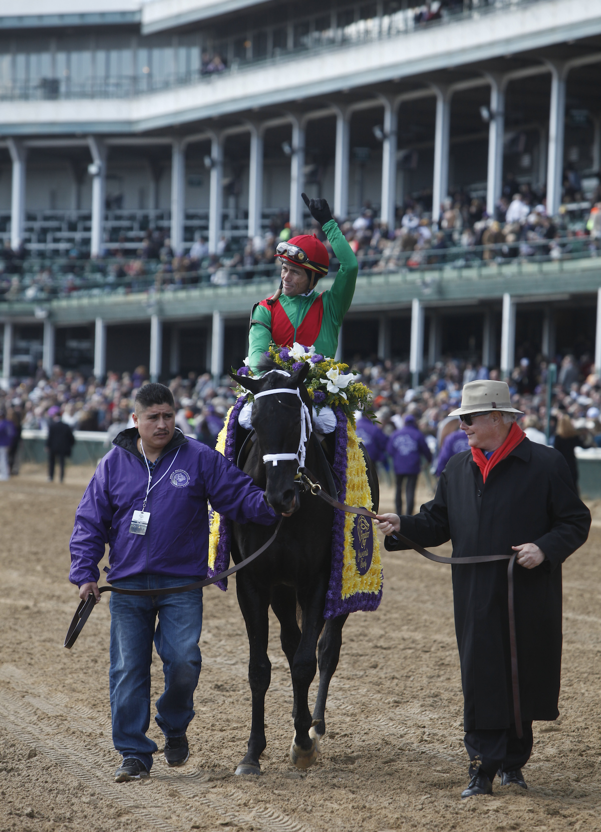 Returning heroes: Team Valor principal Barry Irwin (right) leads in Pluck and Garrett Gomez at Churchill Downs. Photo: © Breeders' Cup/Todd Buchanan