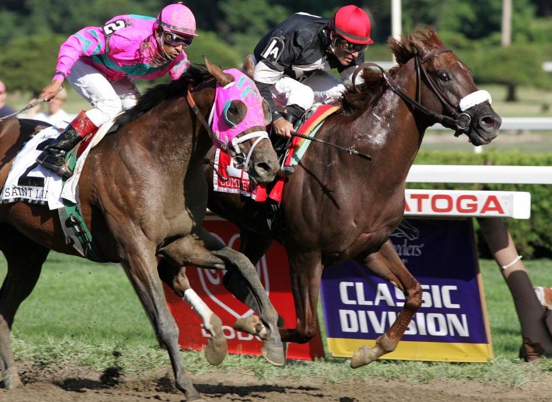 In a gritty display on the biggest stage, Commentator (Gary Stevens) holds off Saint Liam (Edgar Prado) in the 2005 Whitney. Photo: Barbara Livingston