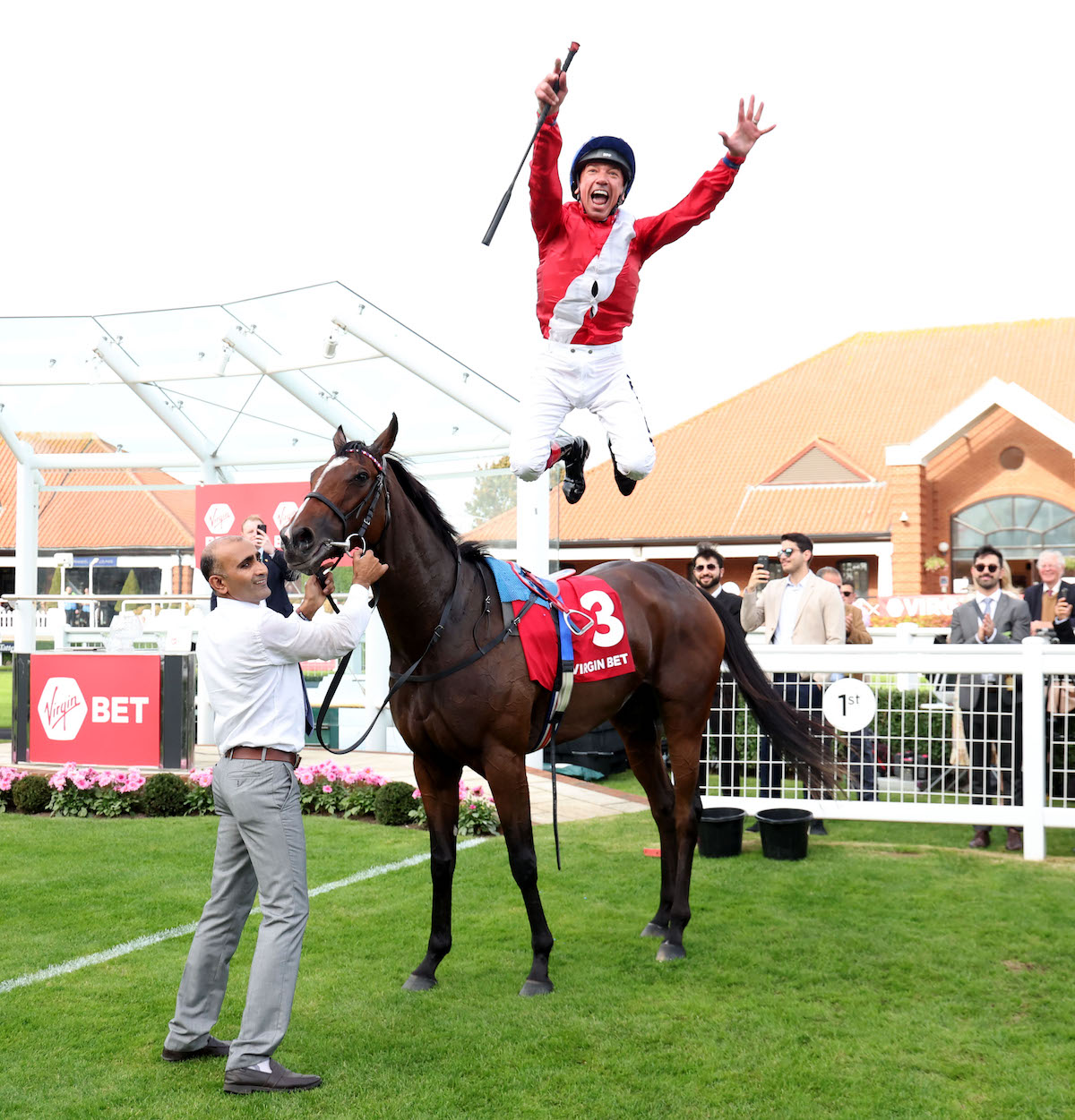 Flying dismount: Frankie Dettori performs his trademark move after a landmark victory on Inspiral. Photo: Dan Abraham / focusonracing.com