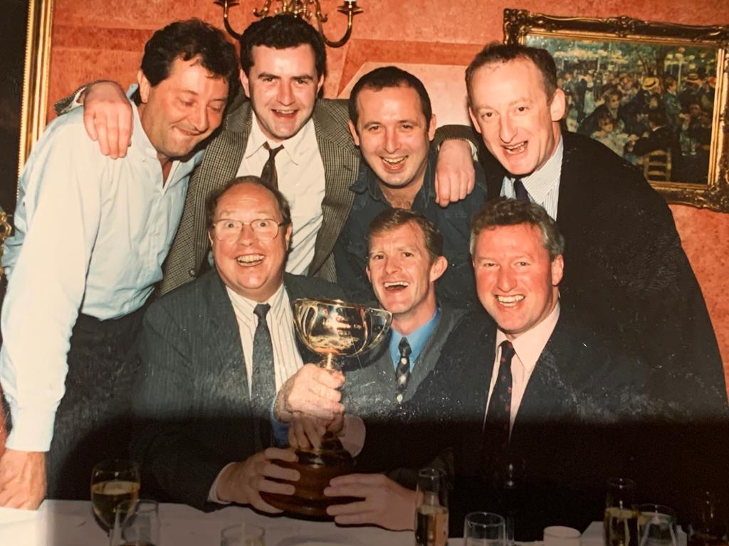 Vintage celebration: members of the overseas press pack in Melbourne share in the triumph with victorious jockey Mick Kinane (front row, centre). Phot JA McGrath