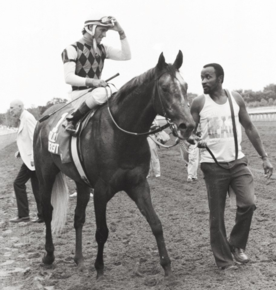 Golden Pheasant and Gary Stevens are led by groom Charles Clay after winning the Arlington Million. (Photo by Suzie Picou-Oldham)