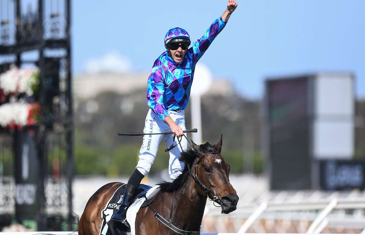 Jockey Declan Bates exultant after Pride Of Jenni wins the Kennedy Champions Mile at Flemington for her second G1 win in a week at the Melbourne Cup Carnival. Photo: VRC / Racing Photos