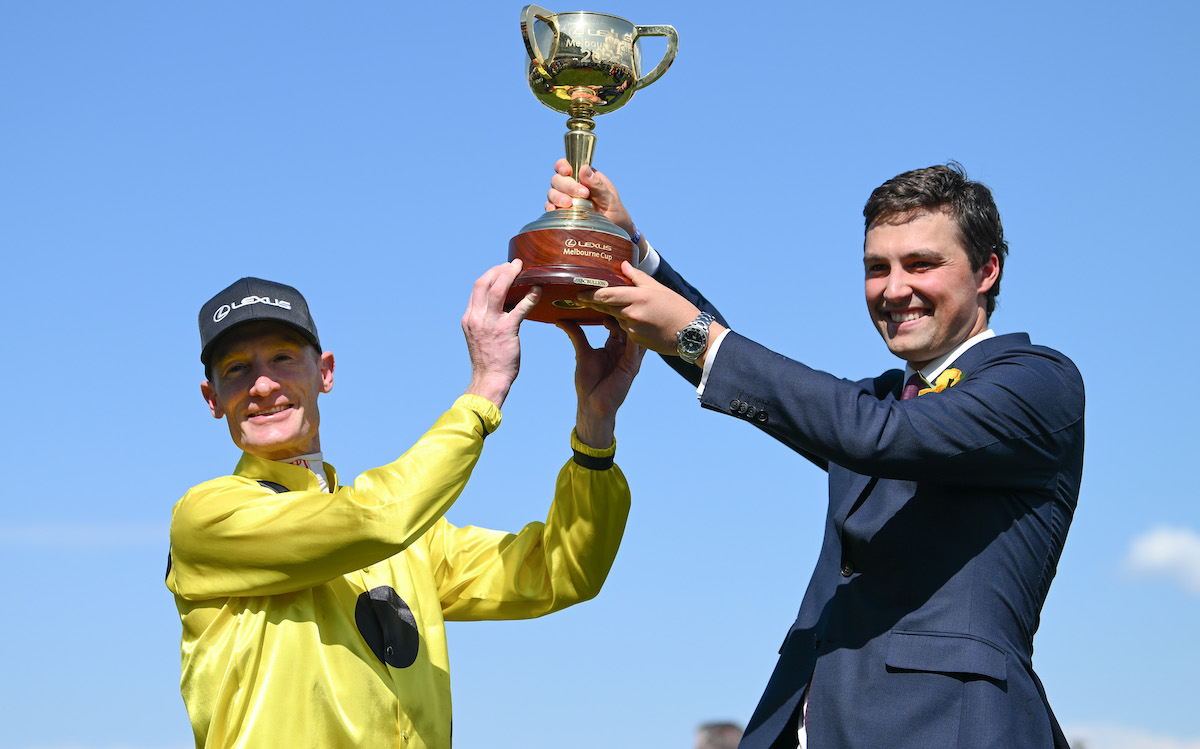 Winning team: Without A Fight’s jockey Mark Zahra and co-trainer Sam Freedman with the Melbourne Cup. Photo: VRC / Racing Photos