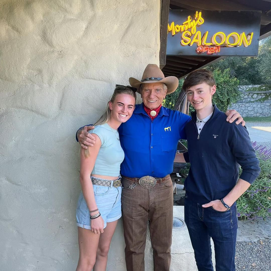 Living the dream Stateside: Sean Kirrane (right) and girlfriend Charlotte Mulhall meet the ‘horse whisperer’ Monty Roberts. Photo supplied