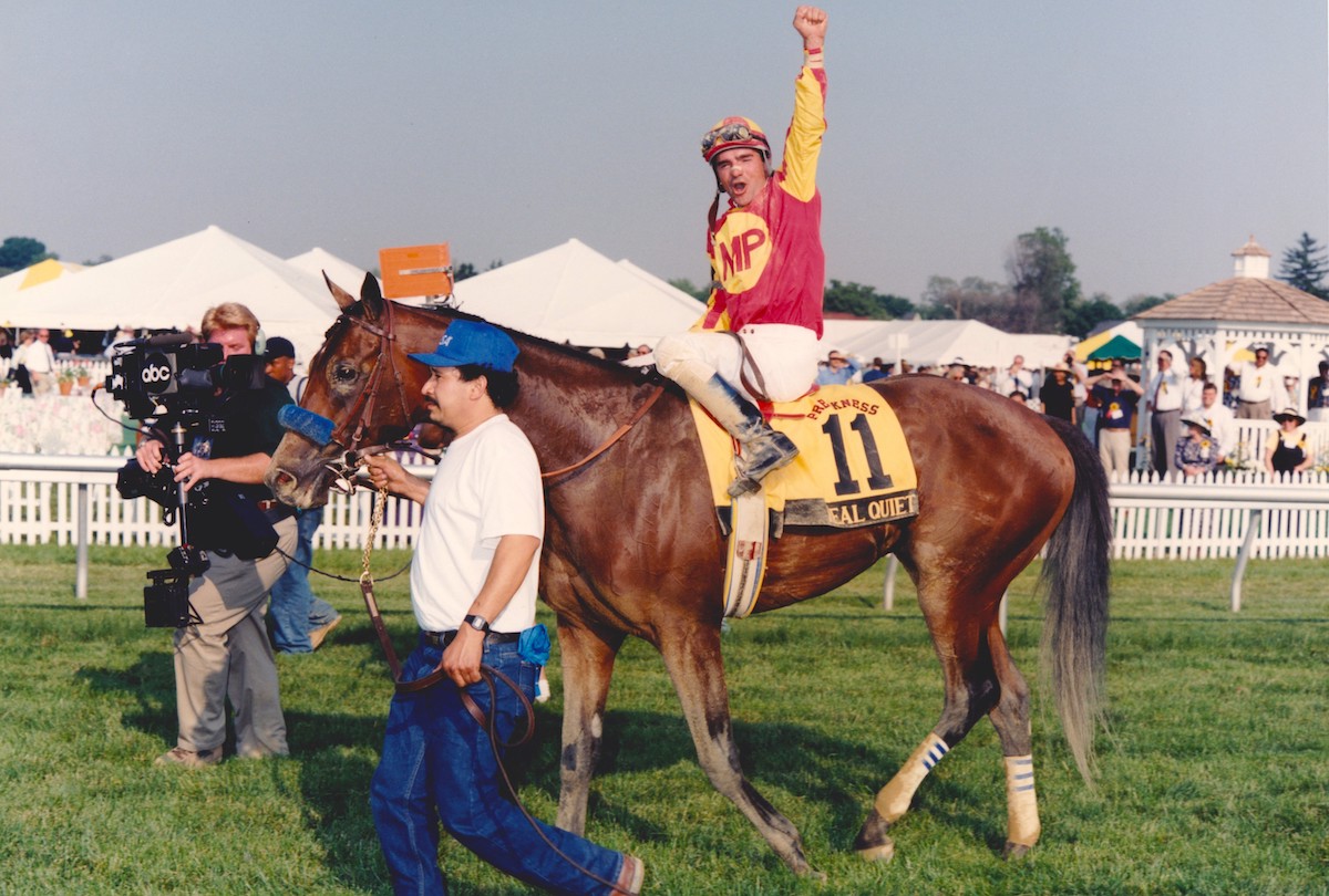 Desormeaux salutes the Preakness crowd as groom Saul Gutierrez leads them in (Maryland Jockey Club photo)