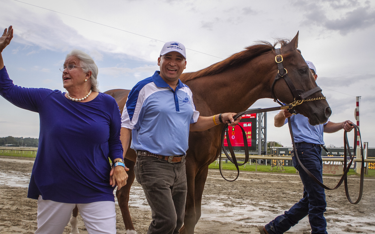 Patricia Chapman, Mario DeJesus-Arriaga, and Rodney Eckenrode (far side) parade Smarty Jones at Parx Racing in 2019 to celebrate the 15th anniversary of his championship season. Photo: Nikki Sherman/PTHA