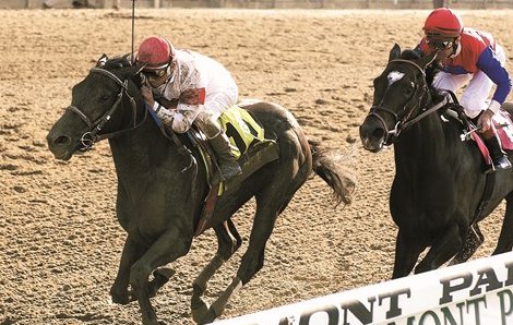 Sarava (Edgar Prado) beats Medaglia d’Oro for a 70-1 shock in the 2002 Belmont. Photo: NYRA / Coglianese