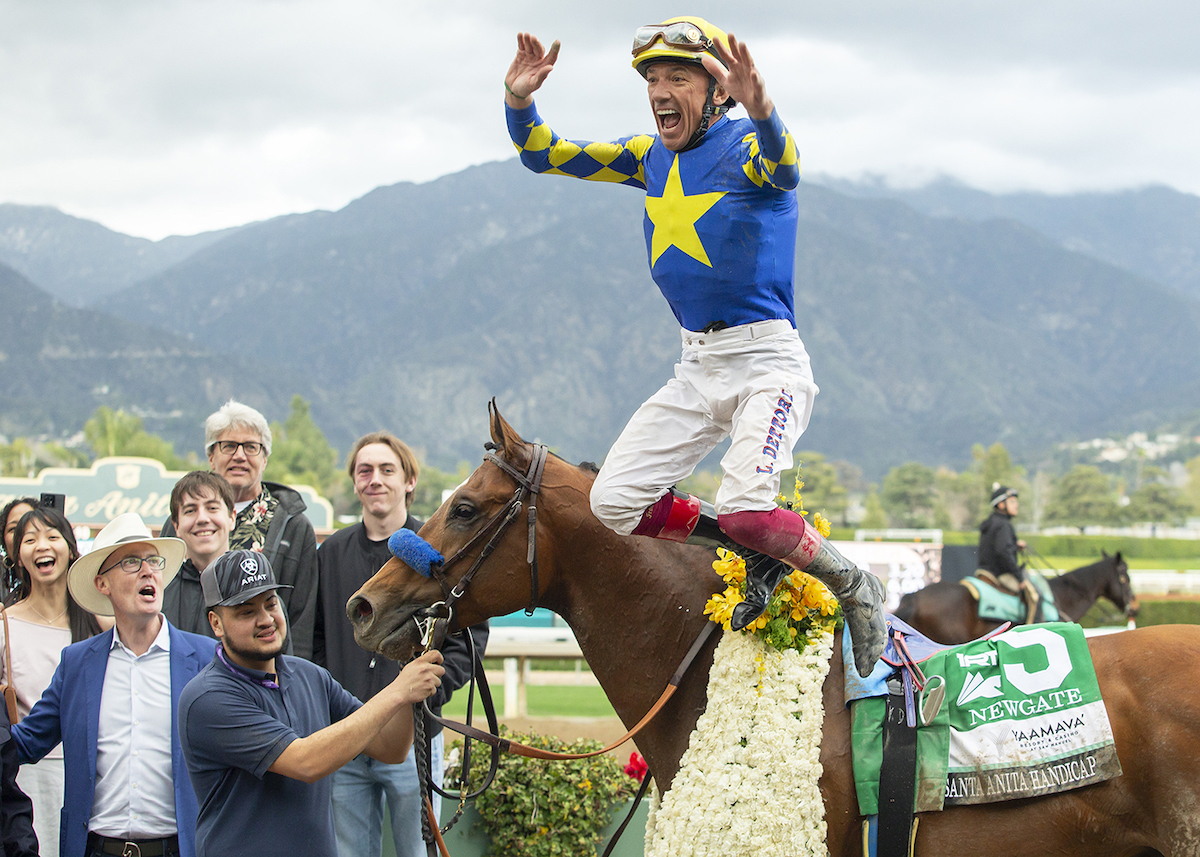 Irrepressible: Frankie Dettori celebrates Newgate’s victory with a flying dismount at Santa Anita. Photo: Benoit