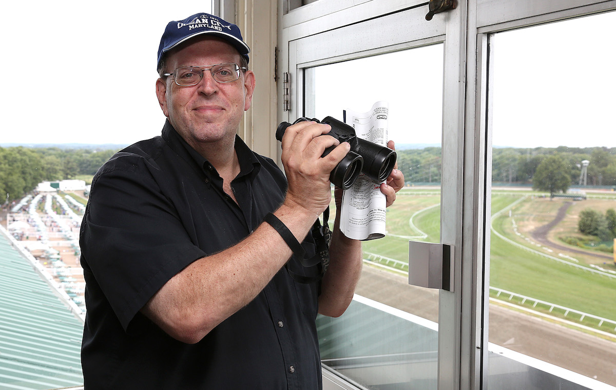Larry Lederman on duty in the booth at Monmouth Park in 2016. Photo: Bill Denver/EQUI-PHOTO