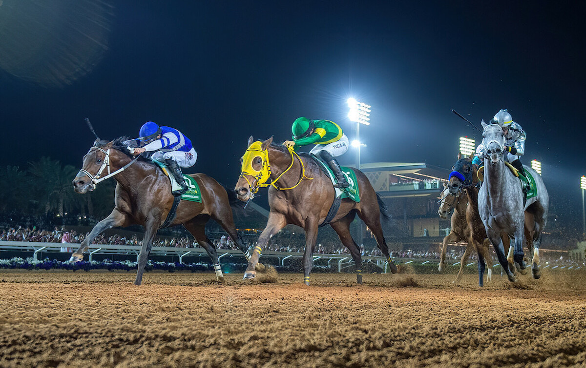 A thrilling climax to the Saudi Cup as Senor Buscador (far side) collars Ushba Tesoro (yellow blinkers) with third-placed Saudi Crown on the rail. Photo: Jockey Club of Saudi Arabia / Azim Shah