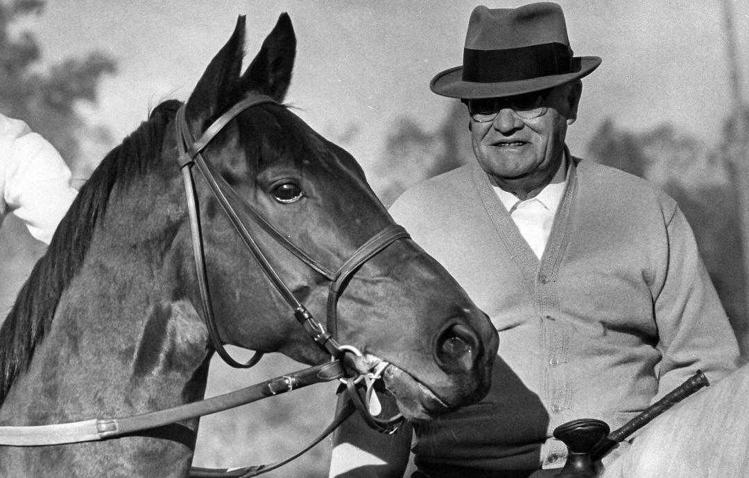 Hill Rise and Bill Finnegan share a moment before the colt is turned loose for an exercise. Photo: Santa Anita