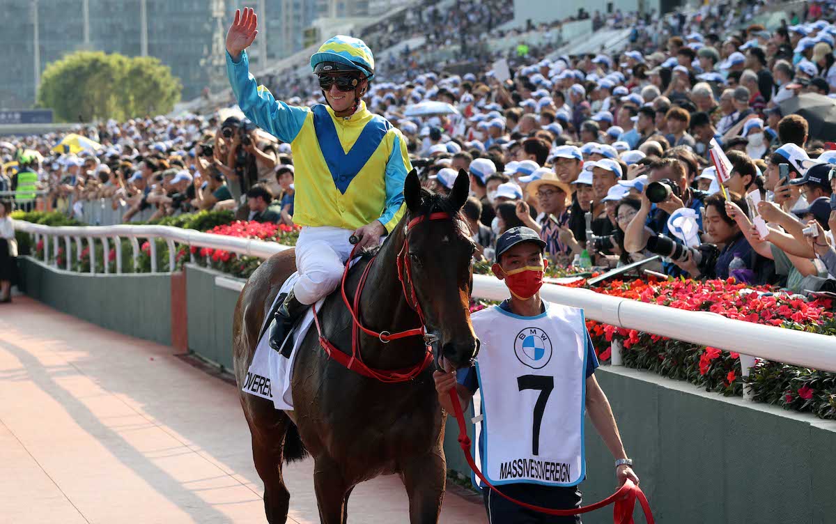 Zac Purton acknowledges the crowd after winning the Hong Kong Derby on Massive Sovereign. Photo: HKJC