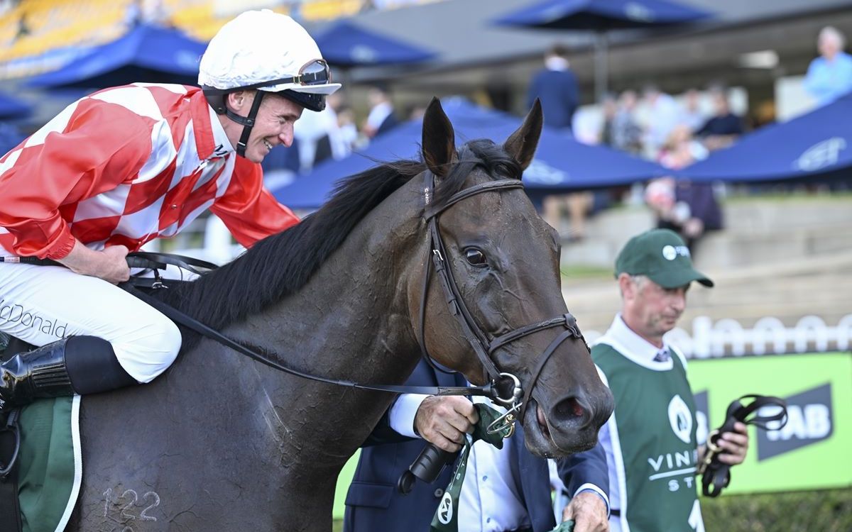 Kiwi team: world #1 jockey James McDonald all smiles after winning Vinery Stud Stakes on NZ Derby winner Orchestral. Photo: Bruno Cannatelli