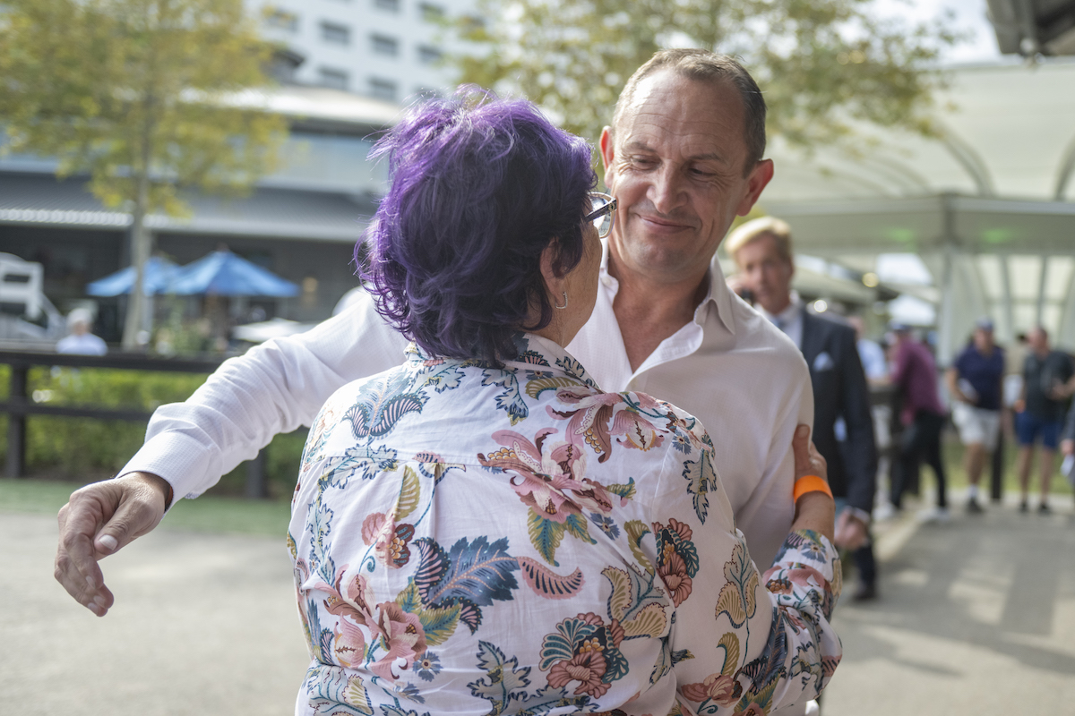 Time for a hug: Winx’s trainer Chris Waller congratulates Deppie Kepitis. Photo: Sharon Lee Chapman