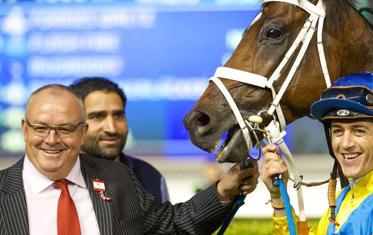 Good times in Dubai: Mike De Kock with Forries Waltz and Christophe Soumillon after victory at Meydan in 2016. Photo: Shamela Hanley / Dubai Racing Club