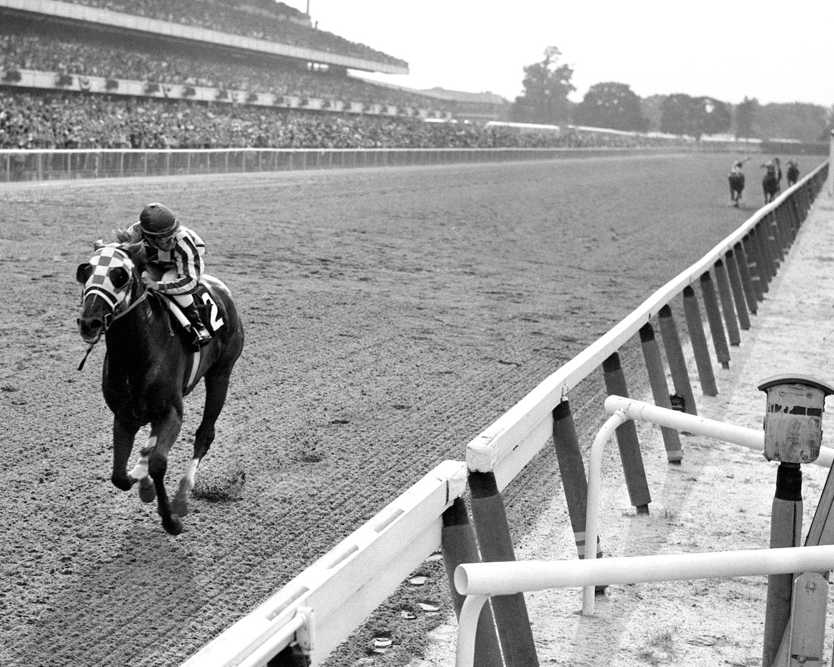 Racing icon: Secretariat and Ron Turcotte complete the Triple Crown with a celebrated 31-length romp in 1973. Photo: NYRA / Coglianese