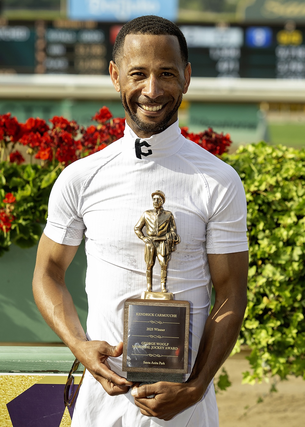 Kendrick Carmouche accepts the annual George Woolf Award at Santa Anita on Saturday [May 31]. Photo: Benoit
