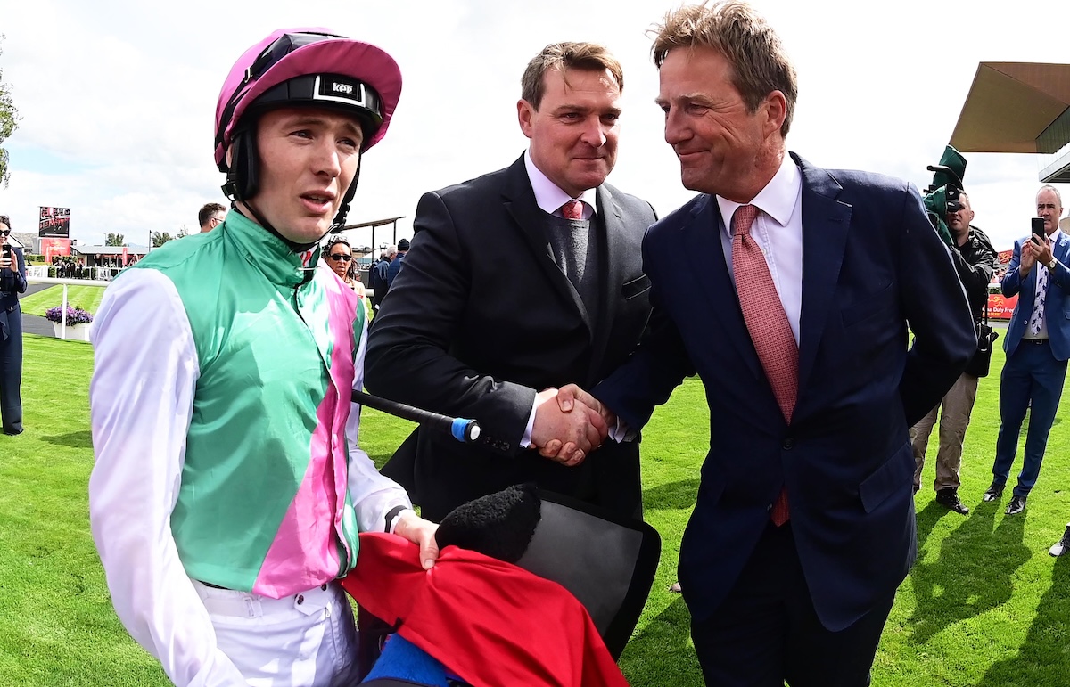 Colin Keane (left) in the Juddmonte silks with racing manager Barry Mahon and trainer Ralph Beckett after winning the Irish Derby on Westover in 2022. Photo: Healy Racing / focusonracing.com