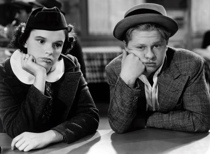 Rooney and Judy Garland put their heads together in Thoroughbreds Don't Cry. (MGM photo)