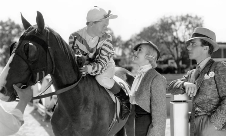 Patricia Ellis and Denis Moore rests their hopes with Rooney as Snapper Sinclair in Down the Stretch. (Warner Bros. photo)
