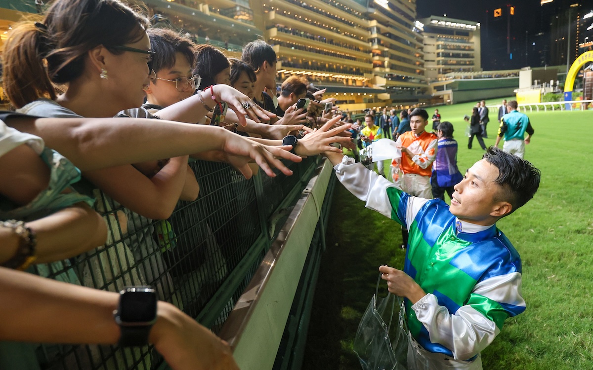Jockeys hand out mini horse plushies to thank racing fans for their support and to celebrate the successful conclusion of the 2024-25 racing season. Photo: HKJC