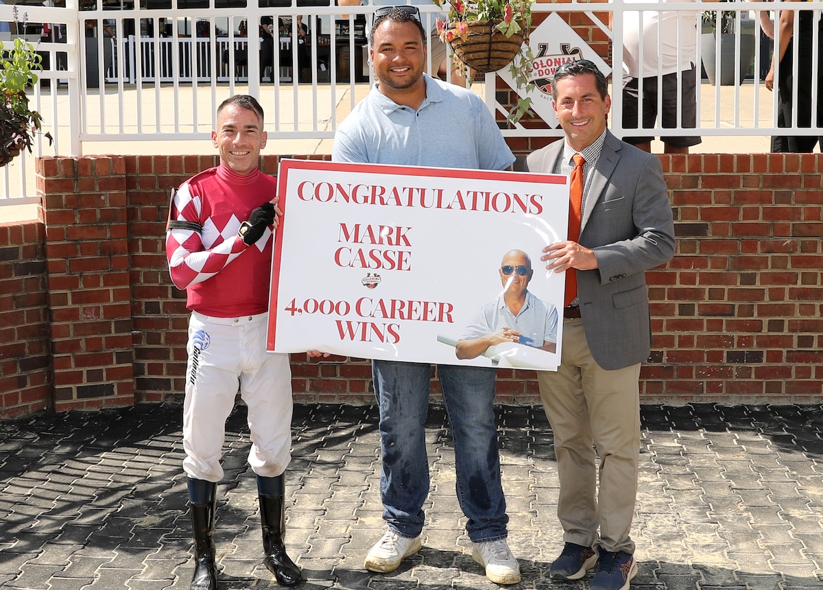 4,000 and counting: Milestone winner for Mark Casse, whose assistant Nick Tomlinson (center) does the honors at Colonial Downs. Photo: Coady Media