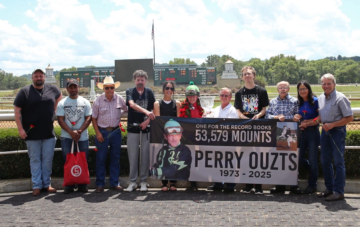 Ironman: Perry Ouzts celebrates his landmark ride at Belterra Park. Photo: Coady Media