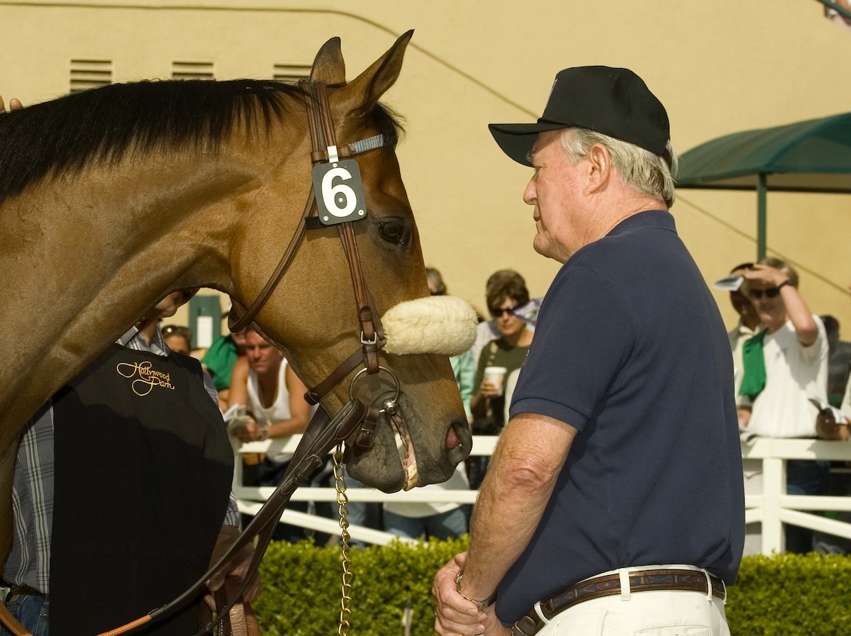 Ralph Todd, The Tin Man's doting owner, shares a quiet moment before his star takes the field. (Benoit photo)