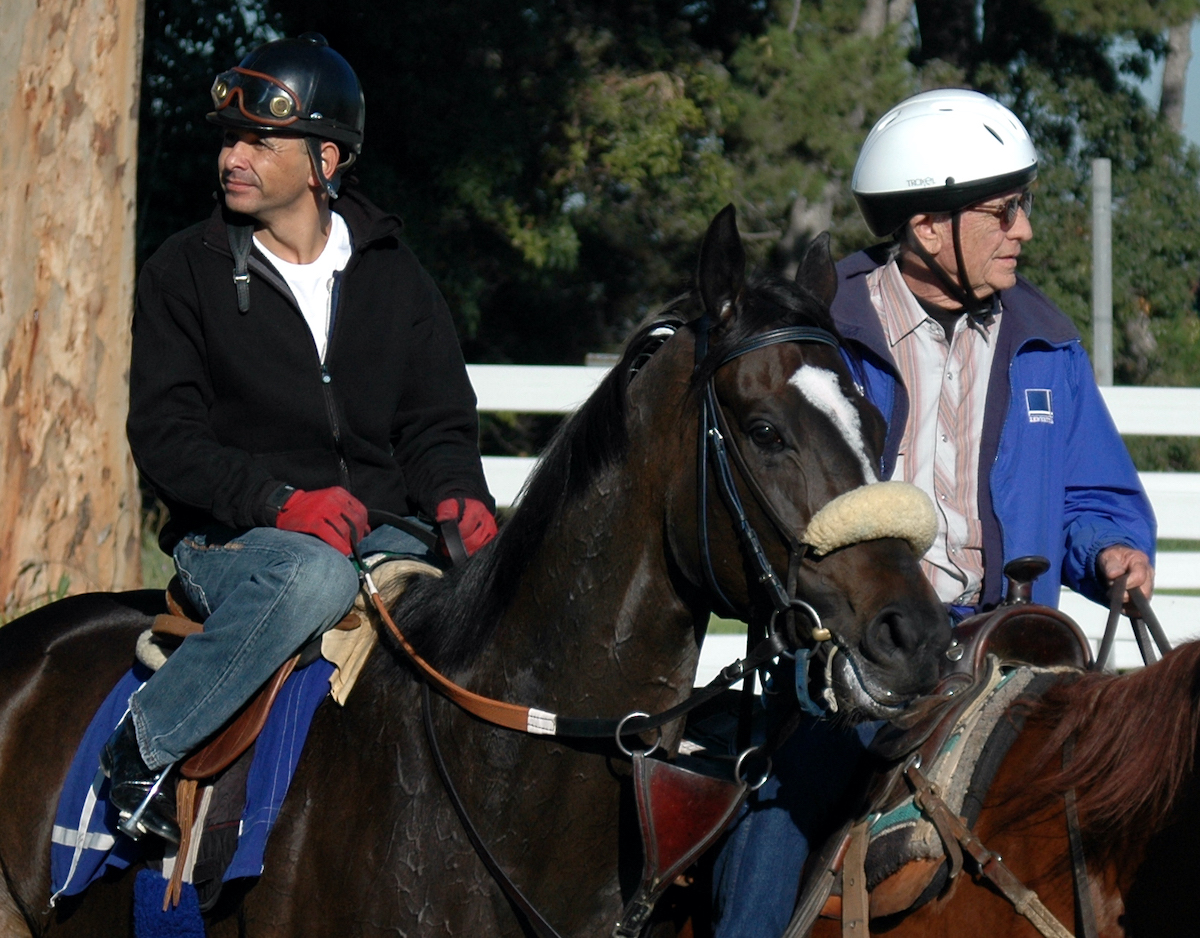 With Freddy Miller on the pony, Mike Smith and Zenyatta return from their final Hollywood work. (Hovdey photo)