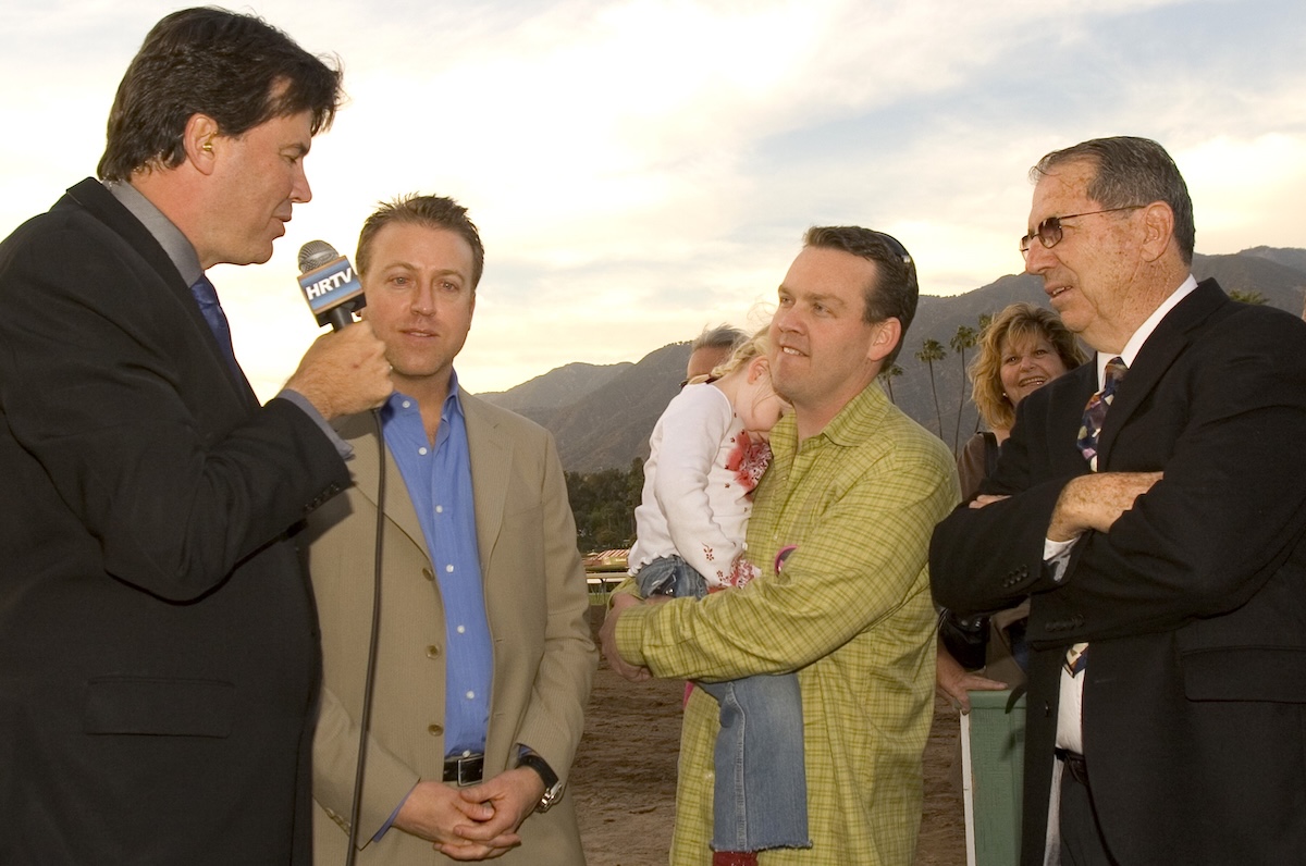Jason Wood and daughter Montana are flanked by Steve Kenly (left) and David Kenly in a winner's circle interview with Kurt Hoover of HRTV. (Benoit photo)