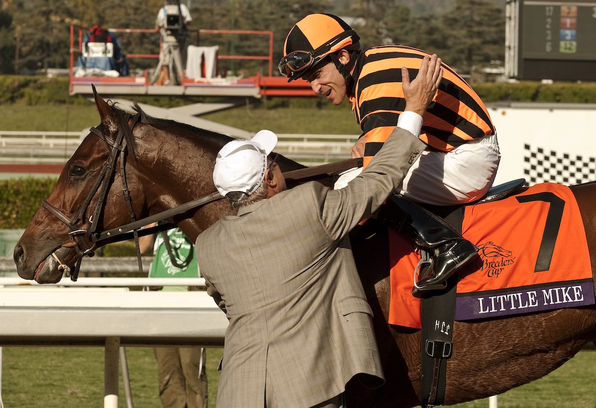 Carlo Vaccarezza is the first to greet Little Mike and Ramon Dominguez after winning the Breeders' Cup Turf. (Benoit photo)