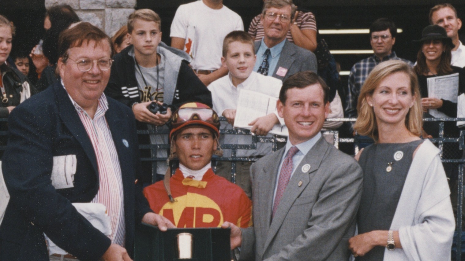 Mr & Mrs William Farish (right) present the Breeders' Futurity trophy to Garrett Gomez and the two-legged Captain Steve. Photo: Keeneland Association/Bill Strauss
